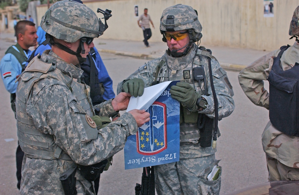 SFC Strickland, with the help of one of his Soldiers