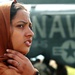 A Pakistani Woman  Watches  as Supplies Are Unloaded From an MH-53 Sea Stal