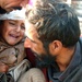 A Father Comforts His Son as a Pakistani Soldier Carries Him to to an MH-53