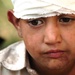 A Pakistani Boy Waits to Board an MH-53 Sea Stallion Helicopter to Be Evacu