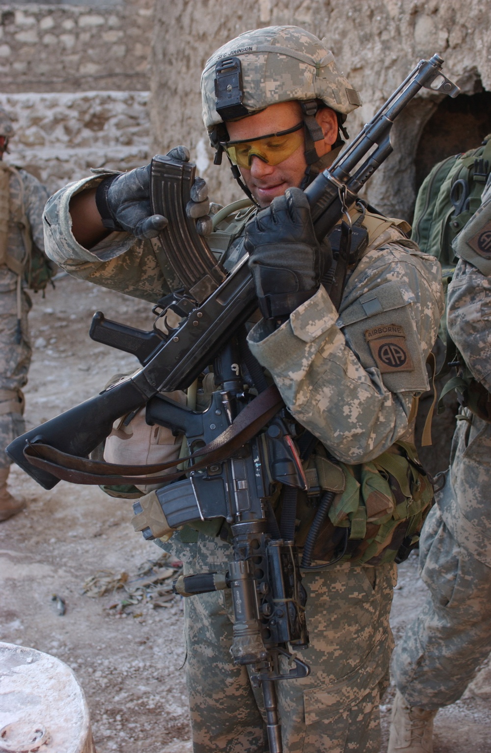 Sgt. 1st Class Johnson places a magazine into an AK-47