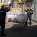 A Sailor Unloads Pallets of Flour, Milk and Bread