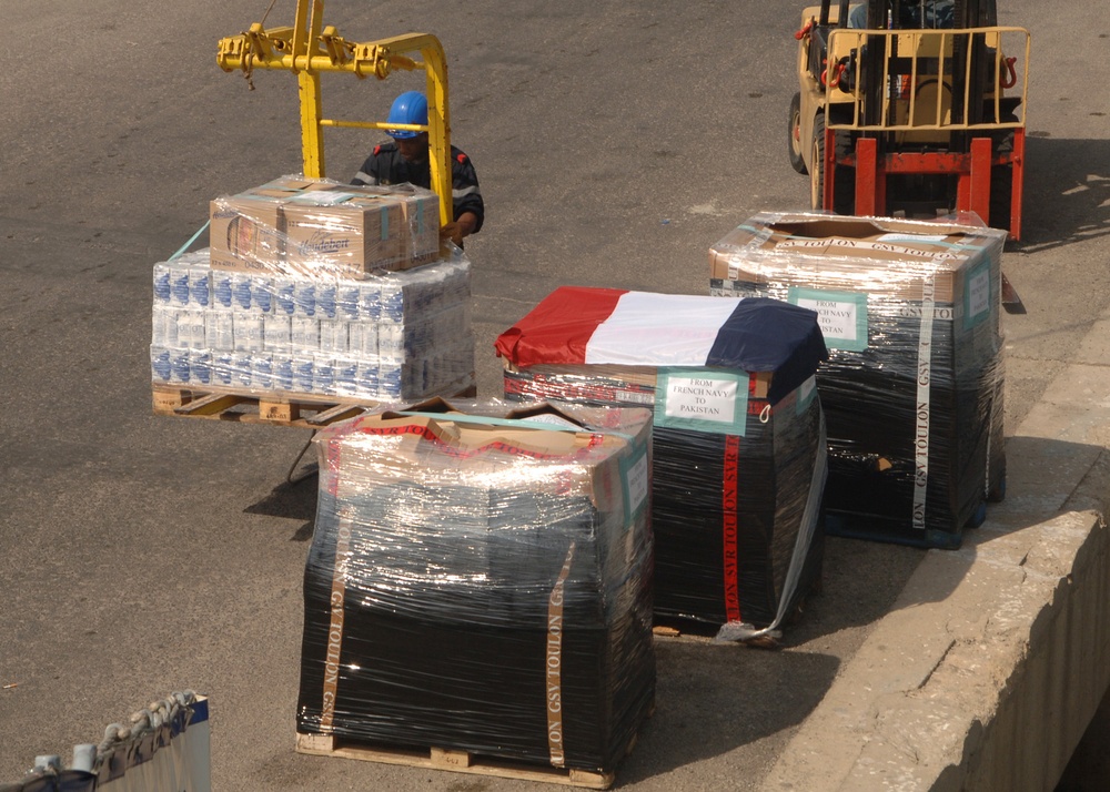 A Sailor Unloads Pallets of Flour, Milk and Bread
