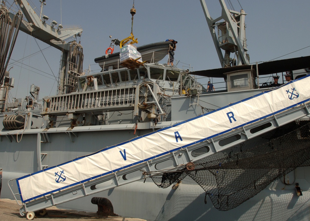 Sailors Unload Pallets of Flour, Milk and Bread