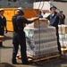 Sailors Load Pallets of Flour, Milk and Bread