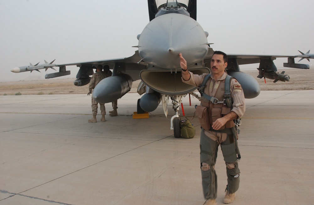 Maj. Darren Censullo does a pre-flight walk around his F-16