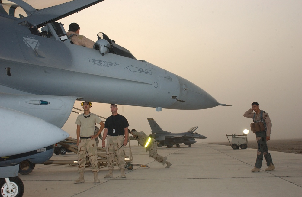 Lt. Col. Monteagudo stands by as an F-16 is readied for launch