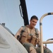 Lt. Col. Jose Monteagudo gets into the cockpit of his F-16