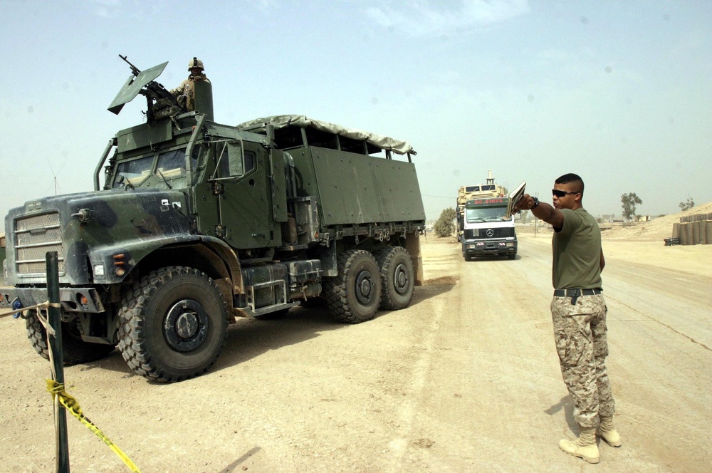 Lance Cpl. Simmons directs a convoy to an offload area