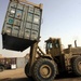 A Rough Terrain Cargo Handler moves an ISO container
