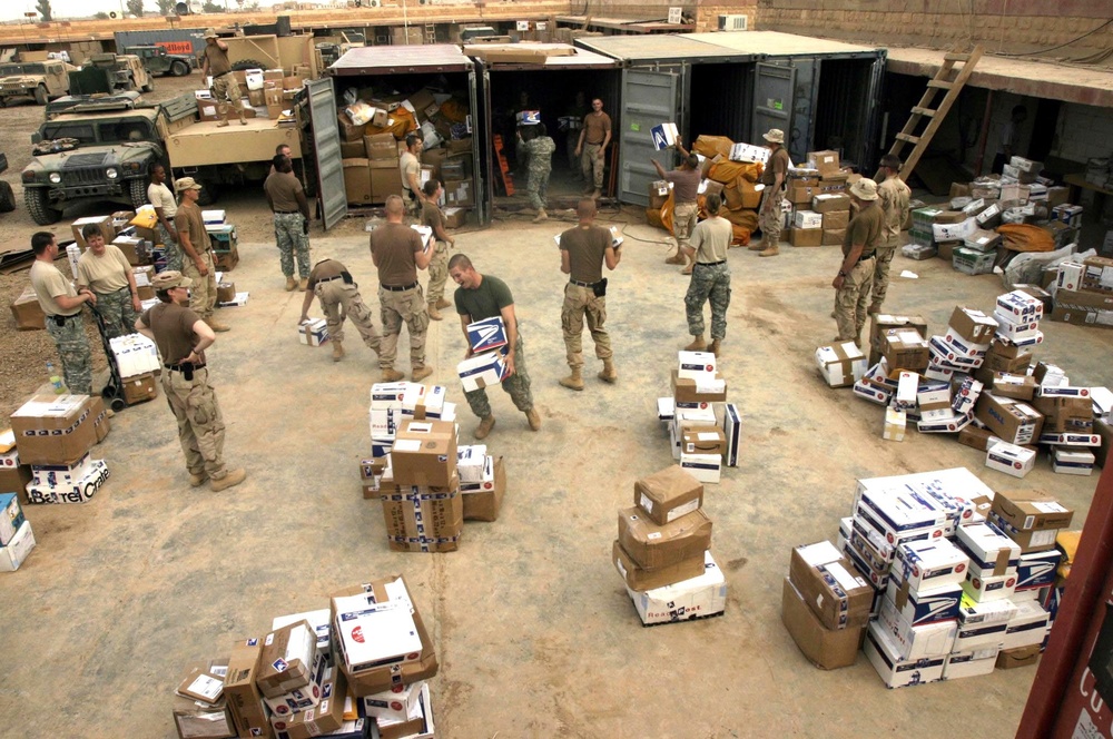 Marines and Soldiers Work to Unload a Shipment of Mail