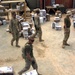 Sgt. Baker Walks by a Shipment of Mail