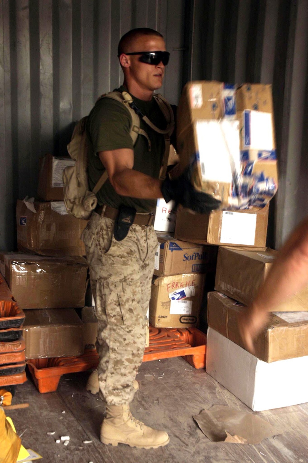 Sgt. Baker Unloads a Care Package