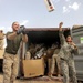 Cpl. Huebner and Spc. Cardenas Unload a Shipment of Mail