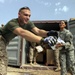 Cpl. Huebner and Spc. Cardenas Unload a Shipment of Mail