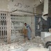 U.S. Soldiers survey Palestine Hotel damage