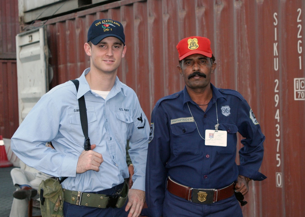 Quartermaster Third Class Simmons Smiles With a Pakistani Police Officer