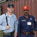 Quartermaster Third Class Simmons Smiles With a Pakistani Police Officer