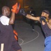 Sgt. 1st Class Williams holds boxing mitts for a Soldier