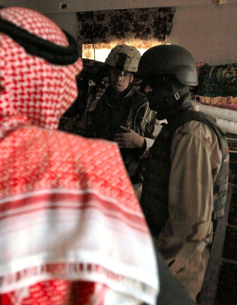 Lt. Webb offers assistance to a resident of Mosul