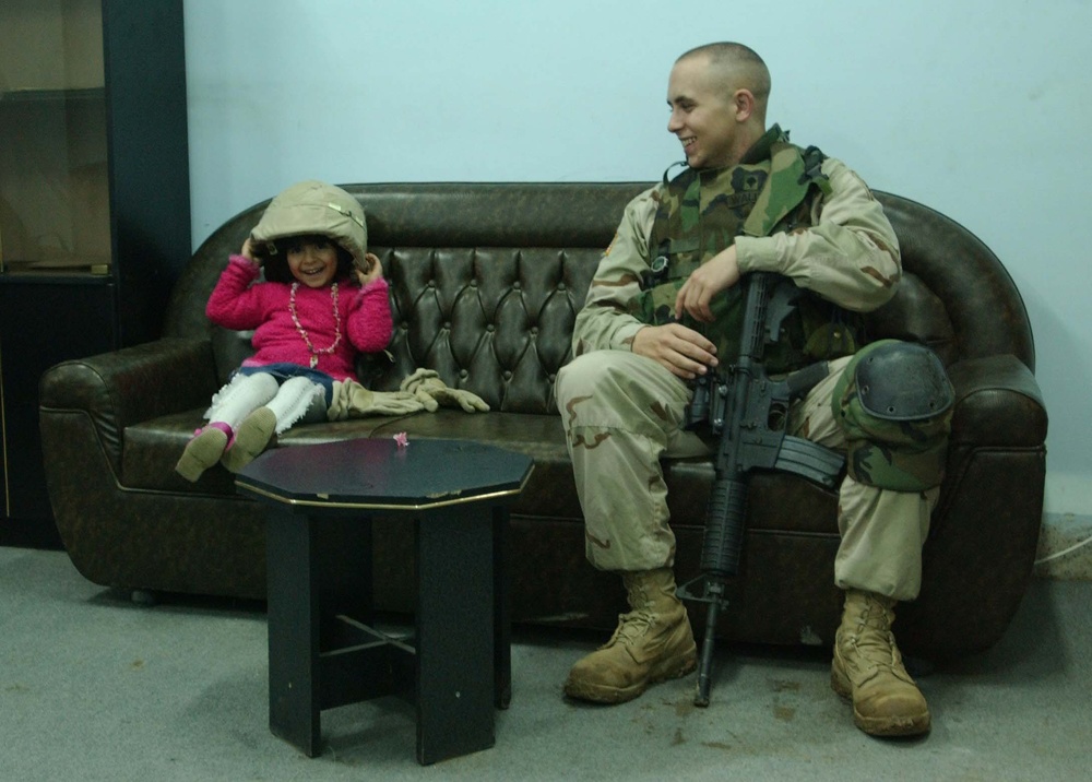 A Task Force Freedom Soldier makes a new friend