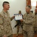 Maj. Gen. David Rodriguez Presents an Award to a Marine