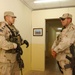 Spc. Ben Heck and SFC Edward Huizar pull security outside a meeting