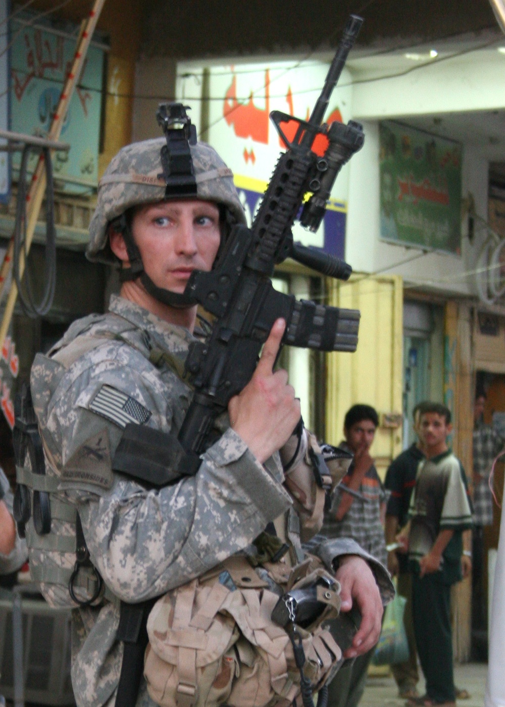 1st Lt. David Disi patrols the Husseiniya market