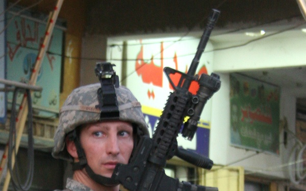 1st Lt. David Disi patrols the Husseiniya market