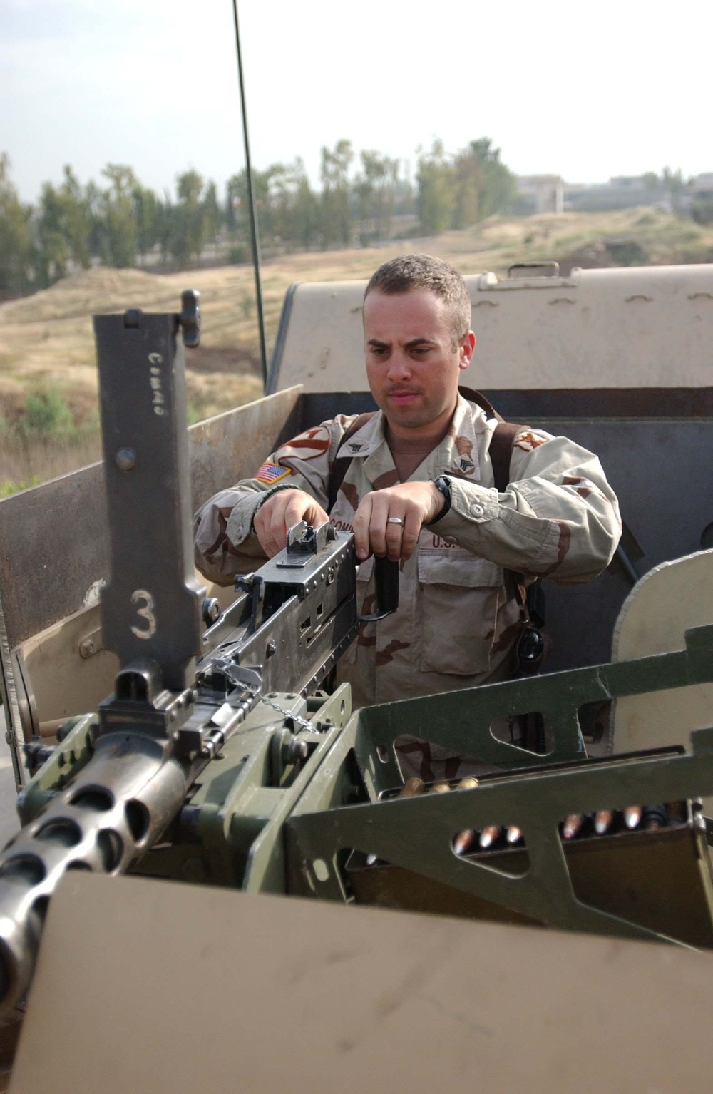 Sgt. Comire prepares his equipment prior to a mission