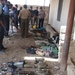 Iraqi Police inventory a weapons cache