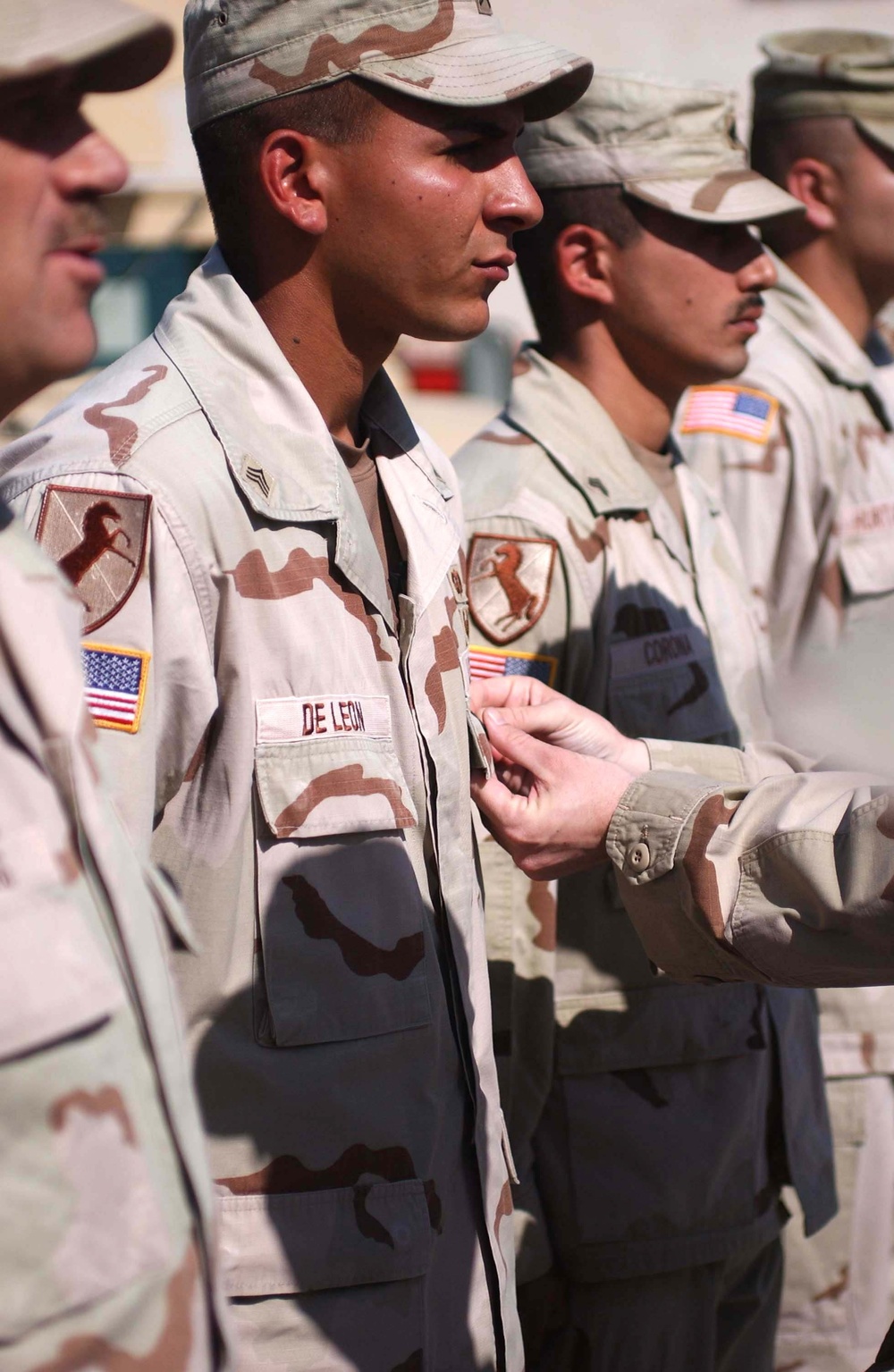 Sgt. Rony DeLeon is pinned with the Combat Action Badge