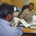 1st Lt. Williams issues a dinar check to a local contractor