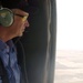 Idaho governor Kempthorne gazes out the door of a Black Hawk