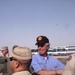 Idaho Governor Kempthorne Helps Soldiers Load Duffel Bags Onto a Truck