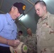 Idaho Governor Kempthorne Signs a Decorated Kevlar Helmet for Spc. Parker