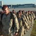 1st COSCOM Soldiers march off the flight line