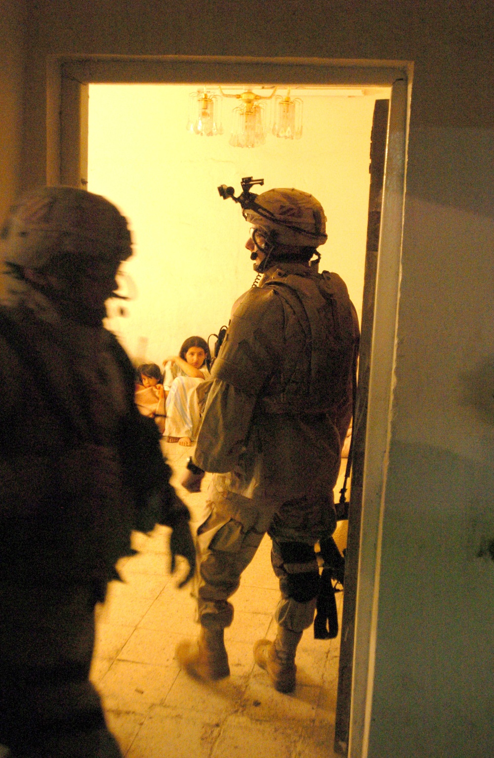 Sgt. Roach keeps an eye on residents during a raid in Zafarania