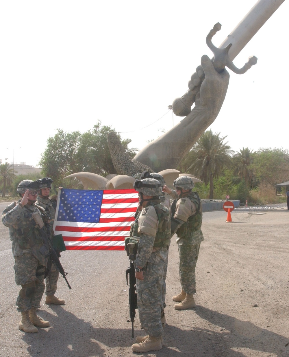 Soldiers re-up under Crossed Swords monument