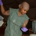 Airman 1st Class Shakira Ramie checks a fluid level