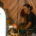 Airman 1st Class Sara Gaines illuminates the area around a fuel filter she