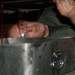 Staff Sgt. Kevin Chandler checks the underside of a vehicle