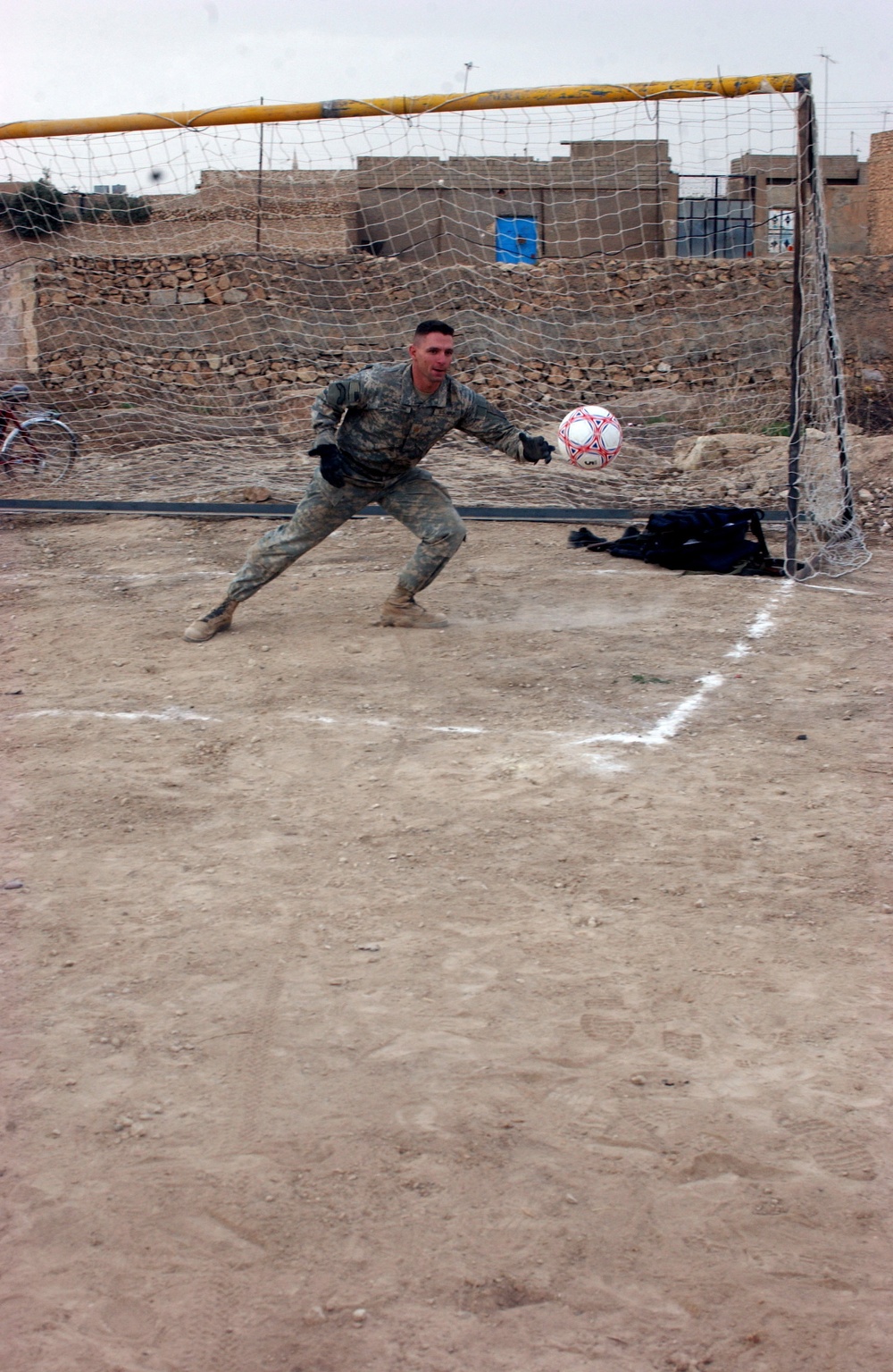 Maj. Masaracchia Reaches for a Soccer Ball