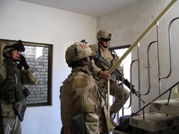 Soldiers conduct a cordon and search