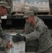 Soldiers unload boxes of bottled water