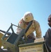 Staff Sgt. Allen and Pfc. Bryant unload and disassemble  the weapon on thei