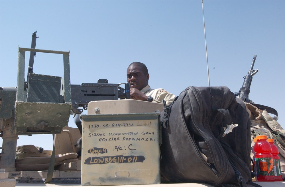 Pfc. Akil Bryant loads the M2 .50 caliber machine gun