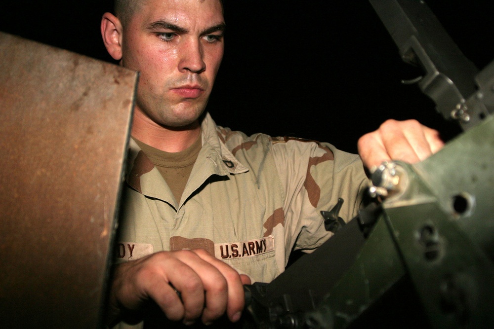 Pfc. Moody checks the headspace and timing on his M2 .50 cal