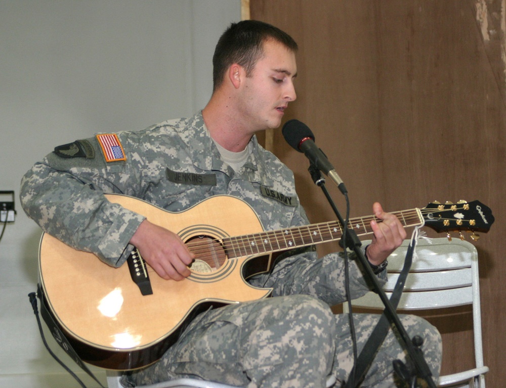 Spc. Barry Jenkins performs the Verve Pipes' &quot;Freshmen&quot; during an MW