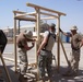 Civil Affairs Soldiers assemble a playground set